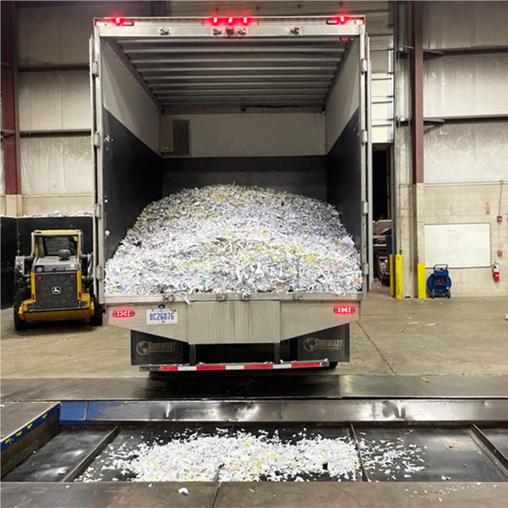 electrocycle shredding truck dumping paper shreddings