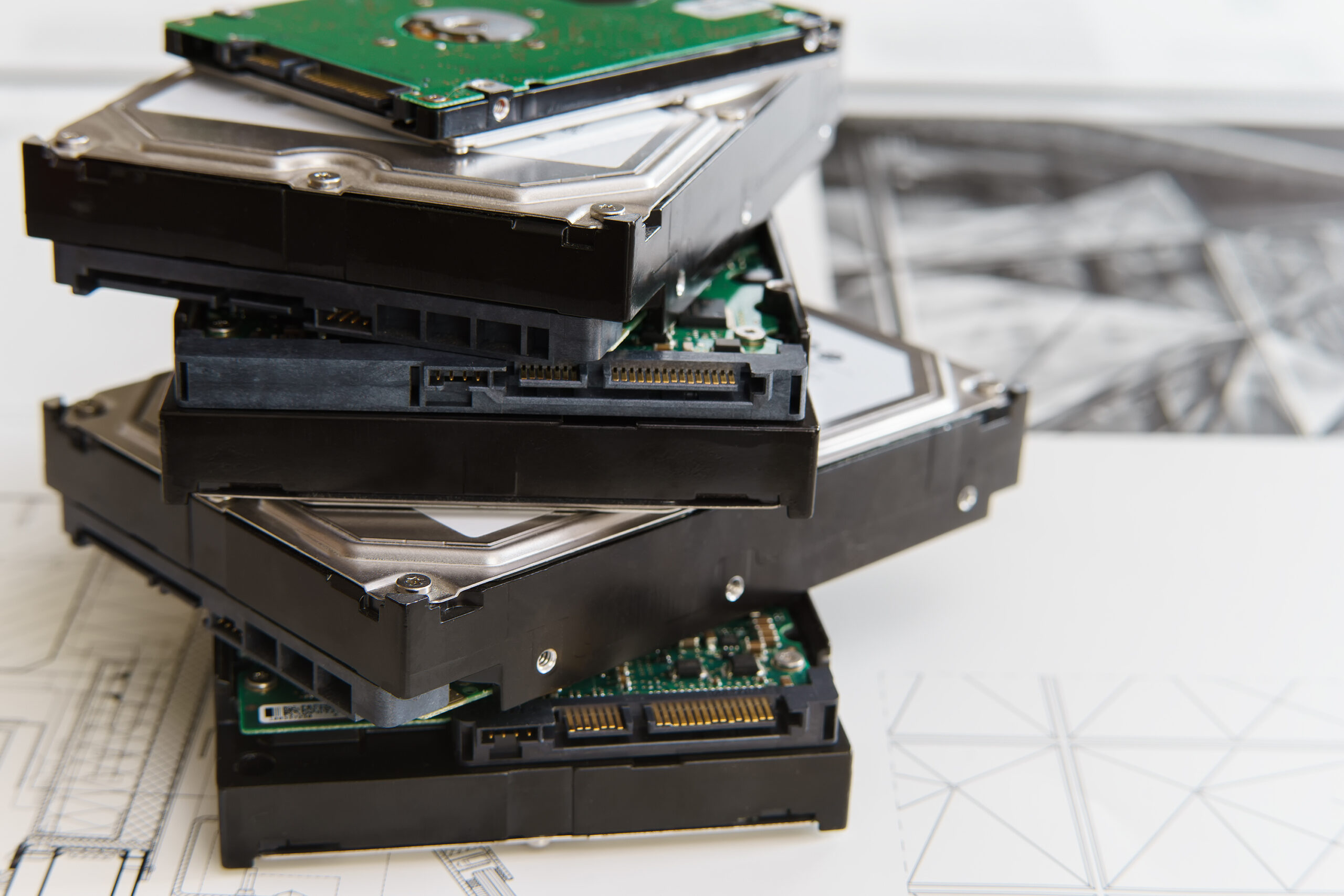 pile of hard drives at white background