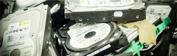 pile of hard drives ready for destruction