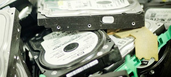 pile of hard drives ready for destruction