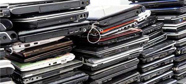 stacks of laptops ready for recycling